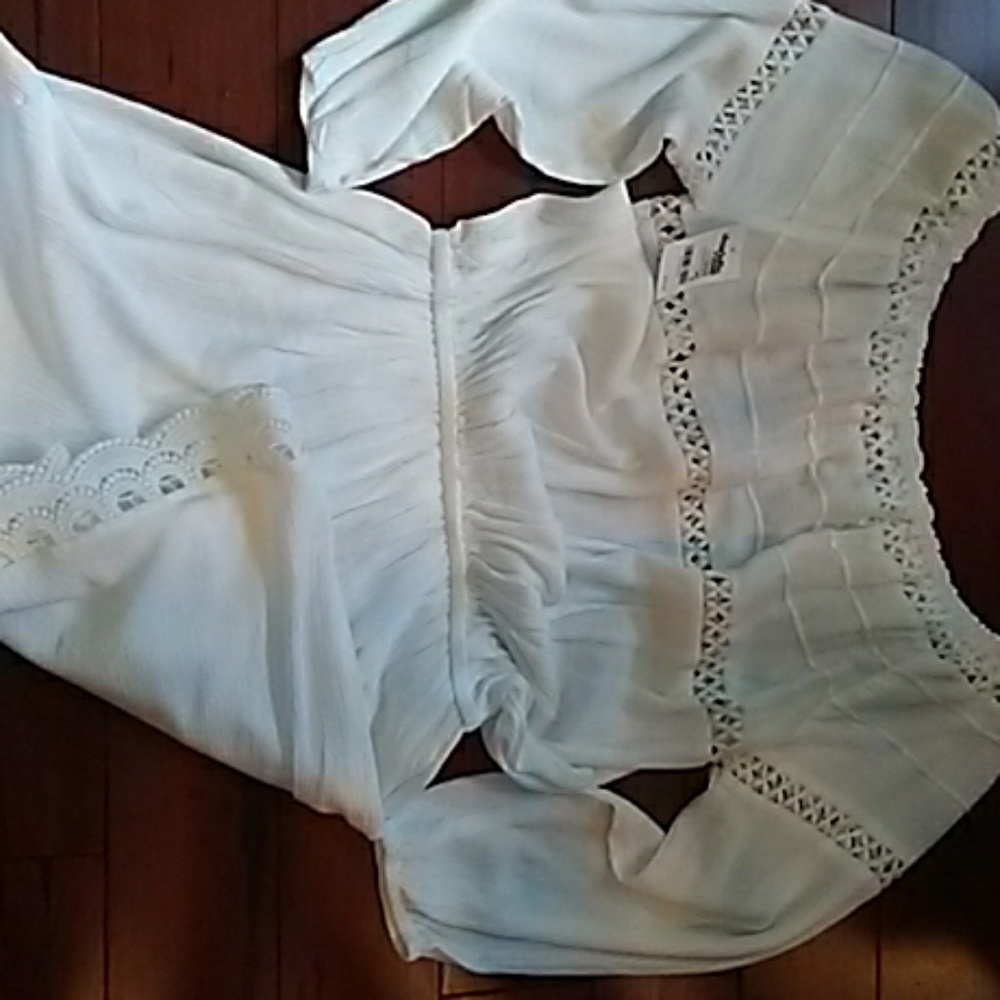 White long sleeve romper .new with tags